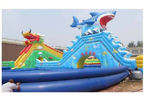 China 0.9MM PVC Tarpaulin Big Dragon / Shark Inflatable Water Park With Large Blue Swimming Pool supplier